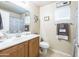 Well-lit bathroom featuring a vanity with storage, ample counter space and a decorative shower curtain at 2725 E Mine Creek Rd # 1208, Phoenix, AZ 85024