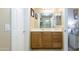 Bright bathroom with vanity, framed mirror and ample lighting at 2725 E Mine Creek Rd # 1208, Phoenix, AZ 85024