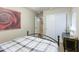 Cozy bedroom with a wrought iron bed frame, neutral walls, and ample closet space for storage at 2725 E Mine Creek Rd # 1208, Phoenix, AZ 85024