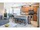 Open-concept kitchen features stainless steel appliances, stone countertops, and a functional island at 2725 E Mine Creek Rd # 1208, Phoenix, AZ 85024