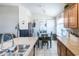 Modern kitchen with stainless sink, adjacent dining area, and custom cabinets for cooking and storage at 2725 E Mine Creek Rd # 1208, Phoenix, AZ 85024
