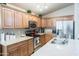 Well-appointed kitchen with granite countertops, stainless steel appliances and ample storage for cooking at 2725 E Mine Creek Rd # 1208, Phoenix, AZ 85024