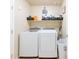 Functional laundry room with modern washer and dryer, shelving and ample storage space at 2725 E Mine Creek Rd # 1208, Phoenix, AZ 85024