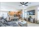 Spacious living room with adjacent kitchen features modern furnishings and a cozy, inviting atmosphere at 2725 E Mine Creek Rd # 1208, Phoenix, AZ 85024