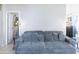 Cozy living room showcasing plush sofa and stylish lighting, providing a relaxing and inviting space at 2725 E Mine Creek Rd # 1208, Phoenix, AZ 85024