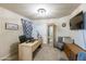 Bright home office featuring a large desk, comfortable seating, and ample storage space for productivity at 2725 E Mine Creek Rd # 1208, Phoenix, AZ 85024