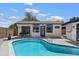 Charming backyard showcasing a private pool, a well-maintained exterior, and a quaint seating area at 2802 E Mercer Ln, Phoenix, AZ 85028