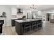Stylish kitchen with a large island, modern appliances, sleek cabinetry, and ample counter space at 2802 E Mercer Ln, Phoenix, AZ 85028
