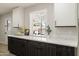 Bright kitchen featuring a window view to outdoor entertaining space, modern counter tops, and cabinetry at 2802 E Mercer Ln, Phoenix, AZ 85028