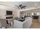 Expansive living room featuring a fireplace, open floor plan, contemporary decor, and bright, natural light at 2802 E Mercer Ln, Phoenix, AZ 85028