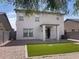 Backyard featuring a small patch of grass and a sliding glass door at 29891 N Desert Angel Dr, San Tan Valley, AZ 85143