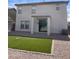 Backyard featuring a small patch of grass and a sliding glass door at 29891 N Desert Angel Dr, San Tan Valley, AZ 85143