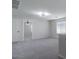 Bonus room with carpeted floor, ceiling fan, and windows with white blinds at 29891 N Desert Angel Dr, San Tan Valley, AZ 85143
