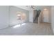 Spacious living room with stylish staircase and tile floors offers plenty of natural light at 29891 N Desert Angel Dr, San Tan Valley, AZ 85143