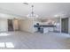 Expansive open floor plan seamlessly connects the kitchen, living, and dining areas, great for entertaining at 29891 N Desert Angel Dr, San Tan Valley, AZ 85143