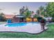 Backyard pool with brick surround and covered patio offers an oasis for relaxation and entertaining in style at 301 W Royal Palm Rd, Phoenix, AZ 85021