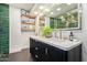 Chic bathroom with dual vanity, marble countertop, gold fixtures, and decor shelving at 301 W Royal Palm Rd, Phoenix, AZ 85021