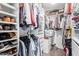 Organized walk-in closet with shelving, drawers, and hanging storage at 301 W Royal Palm Rd, Phoenix, AZ 85021