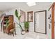 Bright and airy front foyer features marble floors, skylight, decorative plants, and a white front door at 301 W Royal Palm Rd, Phoenix, AZ 85021