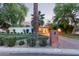 Charming home with brick driveway, lush landscaping, and inviting curb appeal at 301 W Royal Palm Rd, Phoenix, AZ 85021