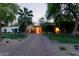 Home with manicured lawn, beautiful plants, and a charming desert landscape at 301 W Royal Palm Rd, Phoenix, AZ 85021