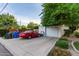 This home features a spacious detached garage, ideal for parking or storage, complete with a paved driveway at 301 W Royal Palm Rd, Phoenix, AZ 85021
