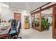 Modern home office features wood detailing, glass doors, natural lighting, and comfortable ergonomic seating at 301 W Royal Palm Rd, Phoenix, AZ 85021