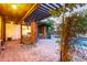 Inviting poolside patio with brick pavers and a covered seating area at 301 W Royal Palm Rd, Phoenix, AZ 85021