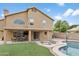 A large backyard with a pool, grassy area, covered patio, and basketball court at 3126 W Stephens Pl, Chandler, AZ 85226