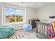 Bright bedroom with a large window and fun accents at 3126 W Stephens Pl, Chandler, AZ 85226
