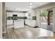 Modern kitchen featuring white cabinets, a center island, and pool views at 3126 W Stephens Pl, Chandler, AZ 85226