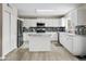 Updated kitchen with white cabinetry, stainless appliances, and granite countertops at 3126 W Stephens Pl, Chandler, AZ 85226
