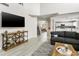 Well-lit living room showcasing open design and seamless flow to other rooms at 3126 W Stephens Pl, Chandler, AZ 85226