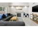 Cozy living room features fireplace, large windows, and comfortable furnishings at 3126 W Stephens Pl, Chandler, AZ 85226