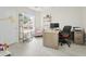 Home office with bright light, desk, pink chair and hardwood floors at 3126 W Stephens Pl, Chandler, AZ 85226