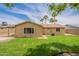 Picture of a spacious backyard showcasing the lawn and exterior of the home at 3620 E Ludlow Dr, Phoenix, AZ 85032