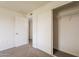 Bright bedroom with carpet, closet, and an adjoining room at 3620 E Ludlow Dr, Phoenix, AZ 85032