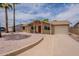 Attractive single-story house with desert landscaping, concrete driveway, and an attached garage at 3620 E Ludlow Dr, Phoenix, AZ 85032