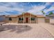 Charming single-story home with desert landscaping, attached garage, and red front door at 3620 E Ludlow Dr, Phoenix, AZ 85032