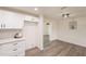 The kitchen has white shaker cabinets, light stone countertops, with gray subway tile and an open floor plan at 3620 E Ludlow Dr, Phoenix, AZ 85032