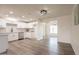 Modern kitchen with white cabinetry, stainless steel appliances, and gray backsplash at 3620 E Ludlow Dr, Phoenix, AZ 85032