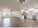 Open-concept kitchen with stainless steel appliances, white cabinets, and a view of the living area at 3620 E Ludlow Dr, Phoenix, AZ 85032