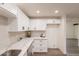 New kitchen featuring white cabinets, stainless steel appliances, a subway backsplash, and light stone countertops at 3620 E Ludlow Dr, Phoenix, AZ 85032