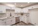 New kitchen featuring white cabinets, stainless steel appliances, a subway backsplash, and light stone countertops at 3620 E Ludlow Dr, Phoenix, AZ 85032