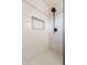 Close up of the updated walk-in shower with new tile and modern fixtures at 3620 E Ludlow Dr, Phoenix, AZ 85032