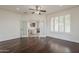 Bedroom with hardwood floors, french doors, plantation shutters, and ceiling fan at 4067 S White Dr, Chandler, AZ 85249