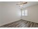 A well-lit bedroom with a ceiling fan and shuttered windows at 4067 S White Dr, Chandler, AZ 85249