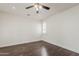 Bright bedroom with hardwood floors, a ceiling fan and plantation shutters at 4067 S White Dr, Chandler, AZ 85249