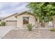 Close up of a single-story home featuring desert landscaping, and a neutral color scheme at 4067 S White Dr, Chandler, AZ 85249