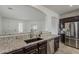 Kitchen counter and sink with granite countertops and stainless appliances at 4067 S White Dr, Chandler, AZ 85249